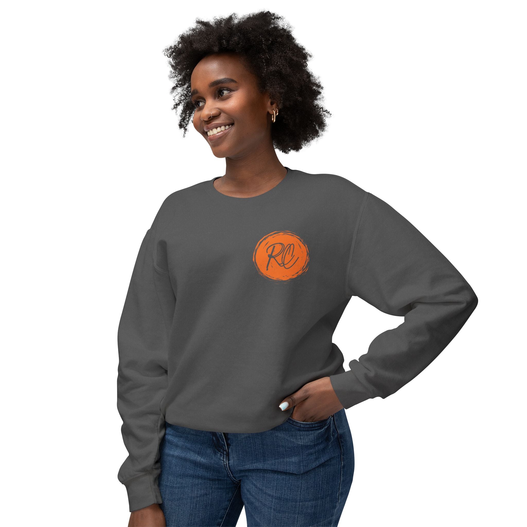 Woman wearing a gray sweatshirt with an orange logo on a white background